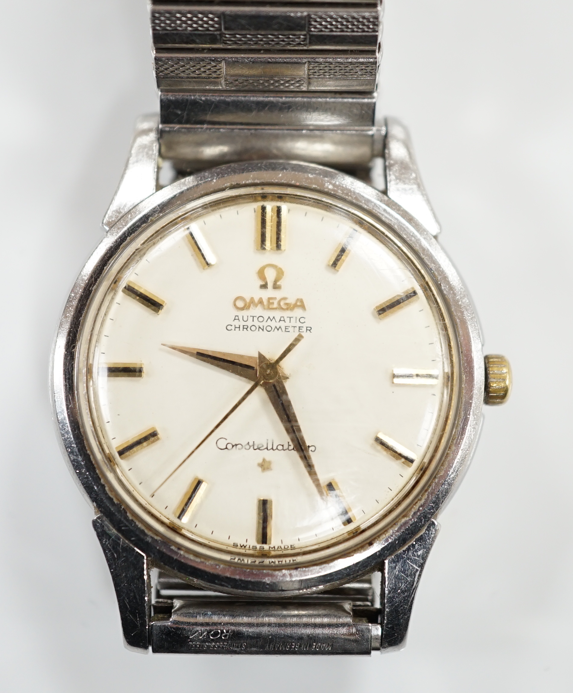 A gentleman's early 1960's stainless steel Omega Constellation Automatic Chronometer wrist watch, on an associated flexible bracelet, case diameter 35mm, movement c.551